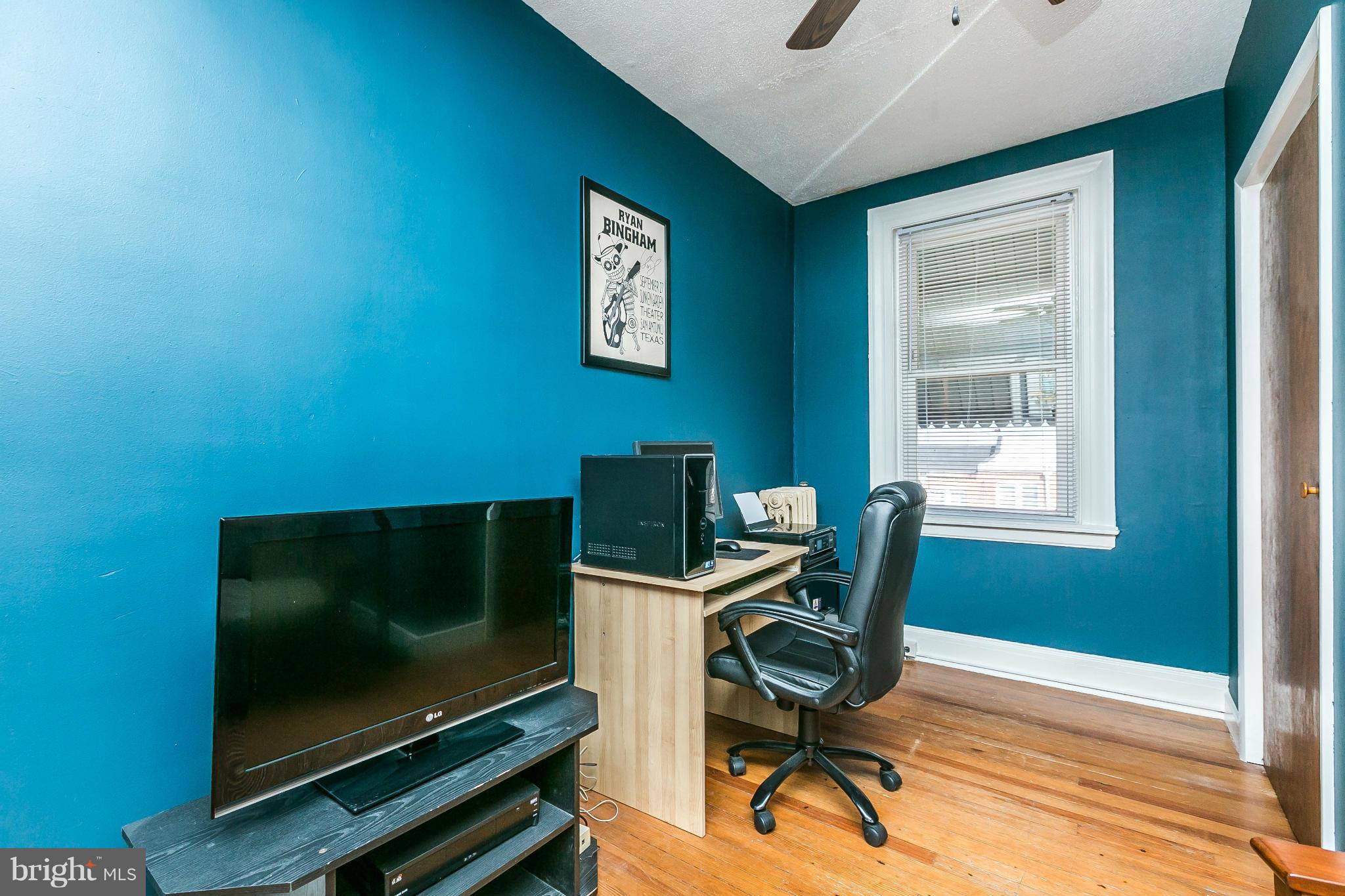3609 Yolando Road Baltimore, MD 21218 - Photo 18 of 27 a work room with furniture and a flat screen tv