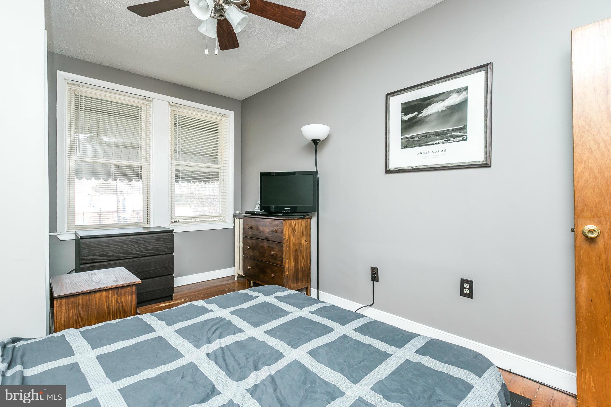 3609 Yolando Road Baltimore, MD 21218 - Photo 20 of 27 a bedroom with a bed and a flat screen tv