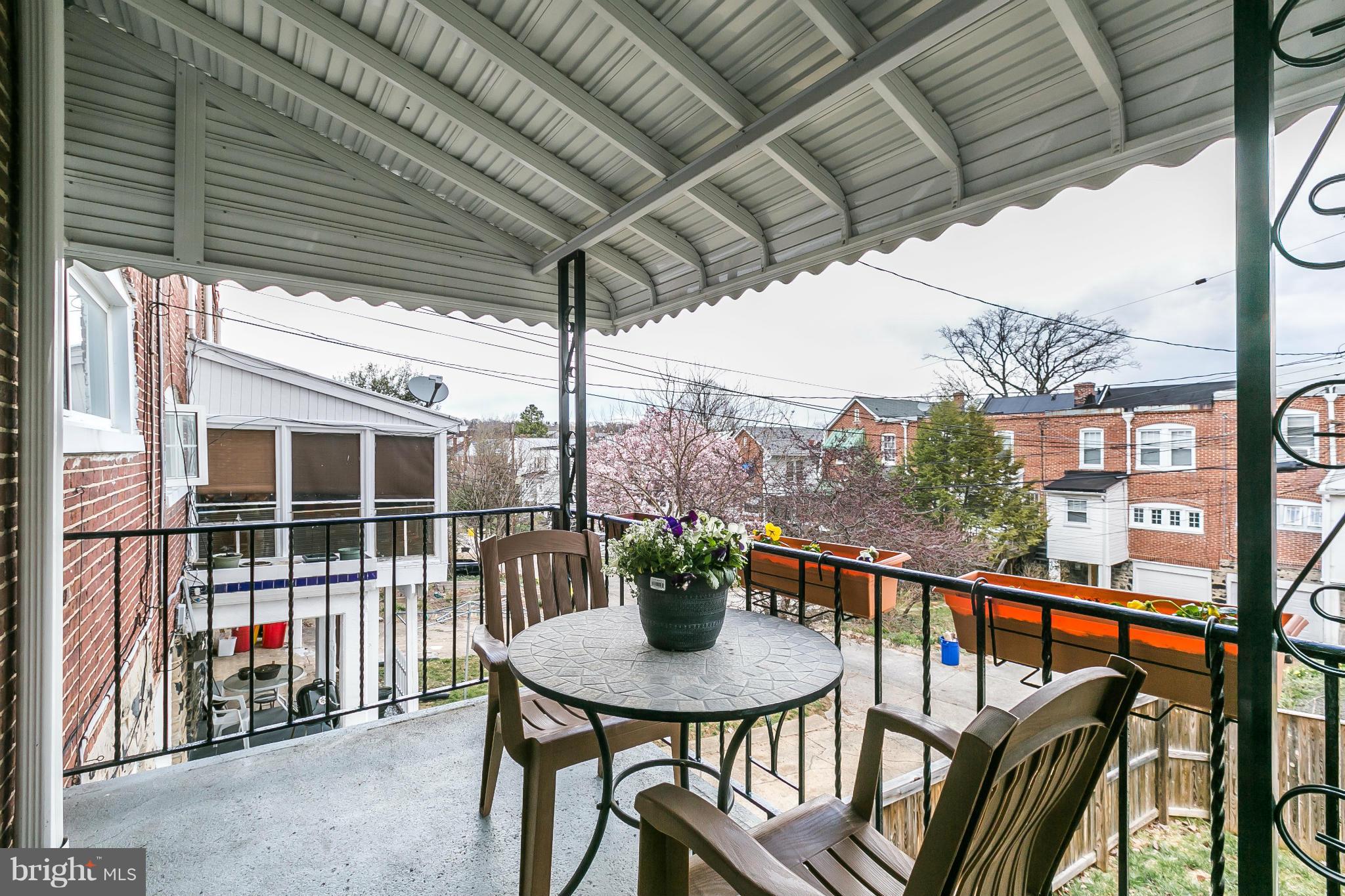 3609 Yolando Road Baltimore, MD 21218 - Photo 26 of 27 a view of a balcony with chair and wooden floor