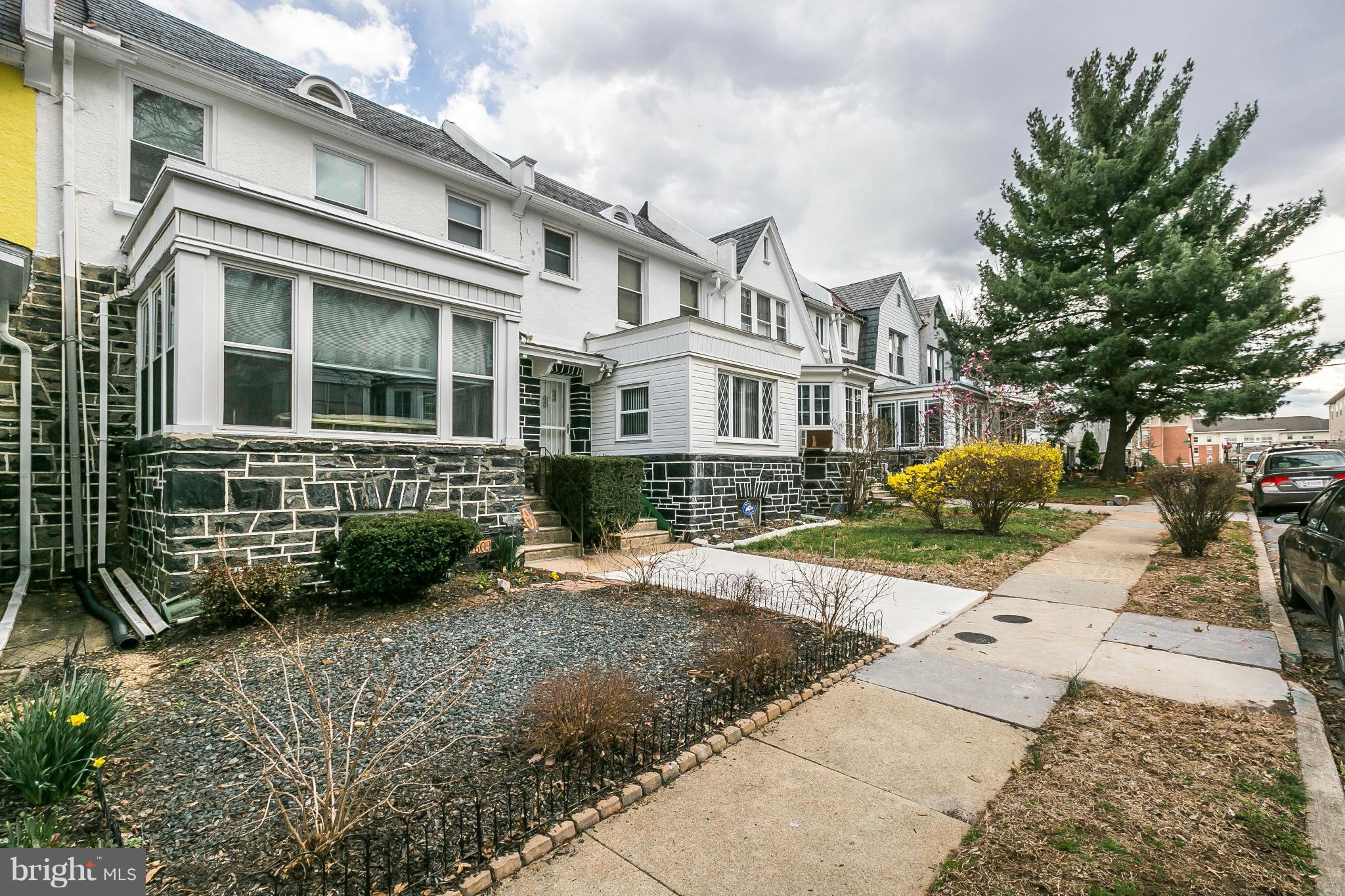 3609 Yolando Road Baltimore, MD 21218 - Photo 4 of 27 a front view of a house with a garden