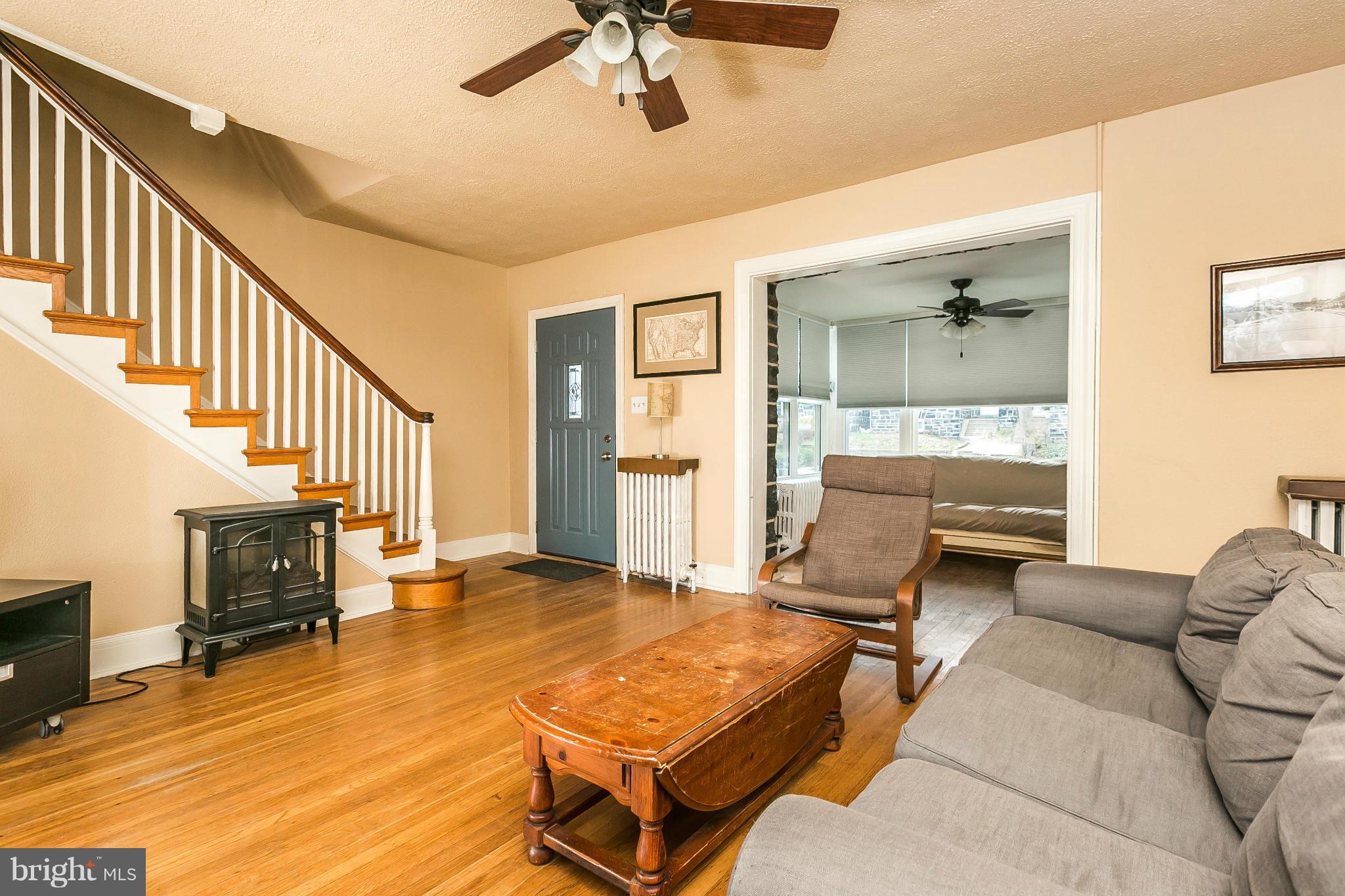 3609 Yolando Road Baltimore, MD 21218 - Photo 6 of 27 a living room with furniture and a fireplace