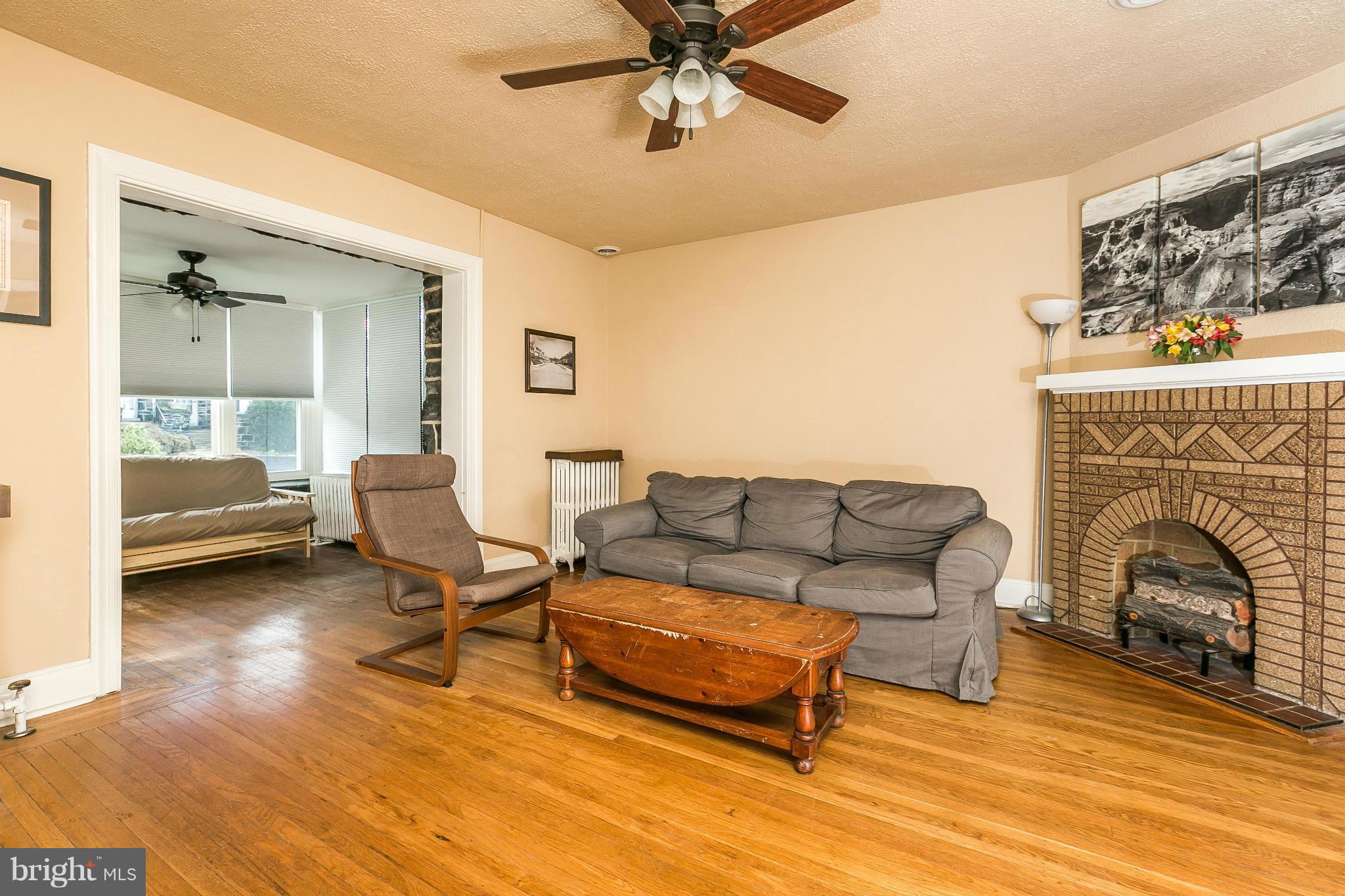 3609 Yolando Road Baltimore, MD 21218 - Photo 7 of 27 a living room with furniture and a fireplace