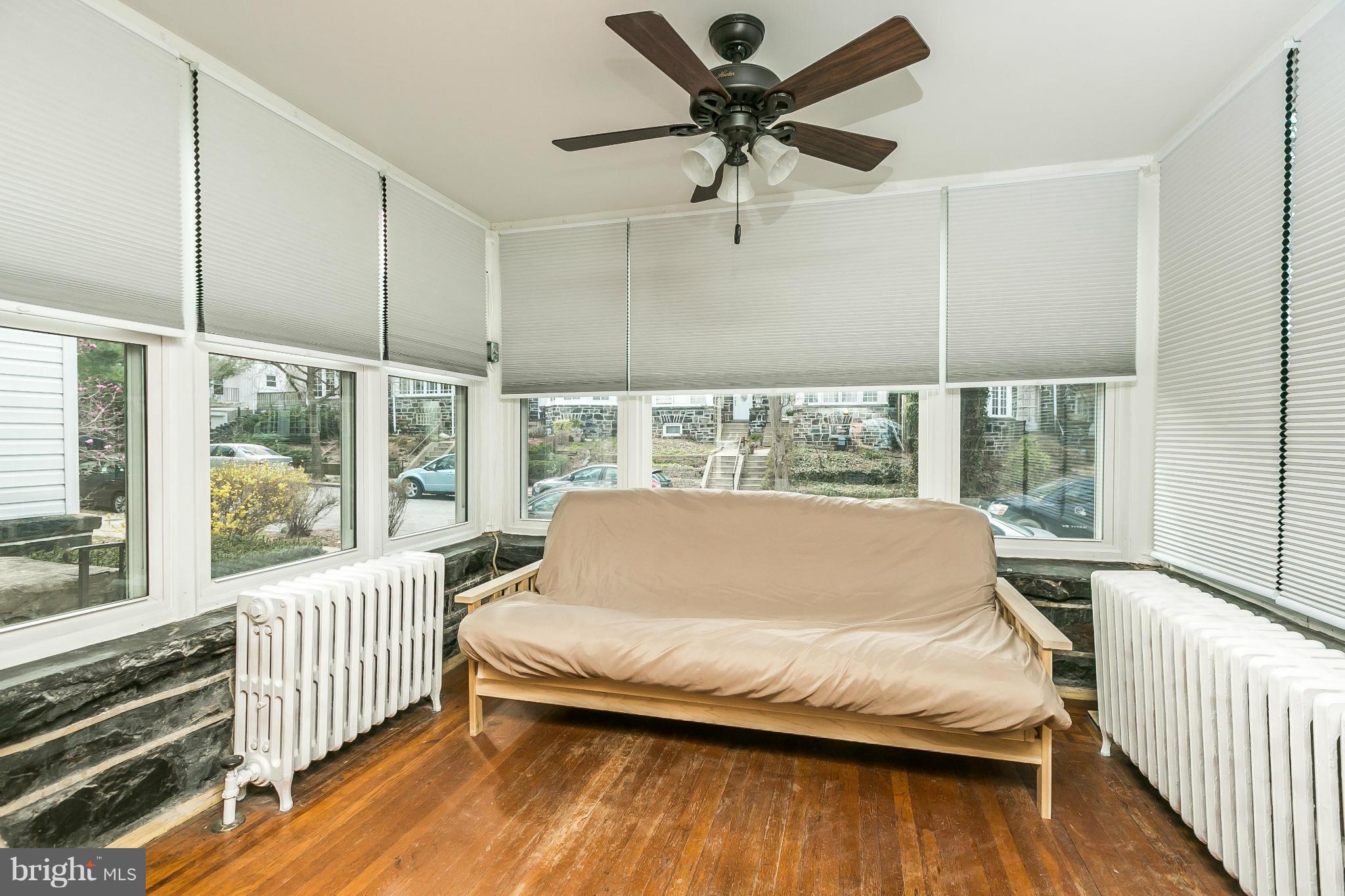 3609 Yolando Road Baltimore, MD 21218 - Photo 8 of 27 a bed sitting in a balcony with a large window