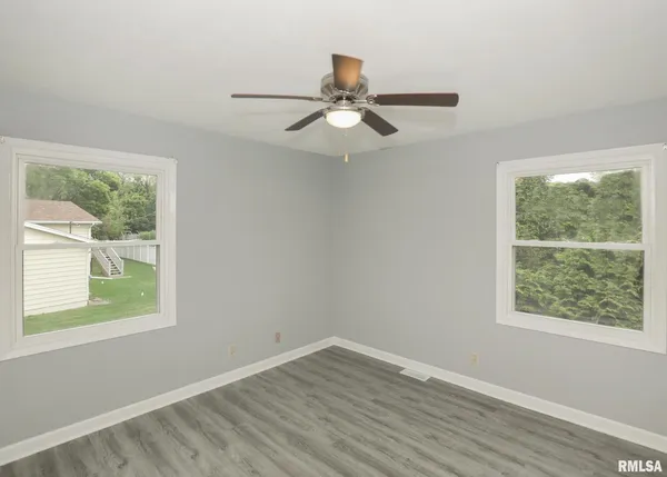 a kitchen with a sink cabinets and a window