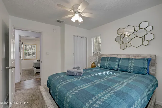 a bedroom with a bed and a table