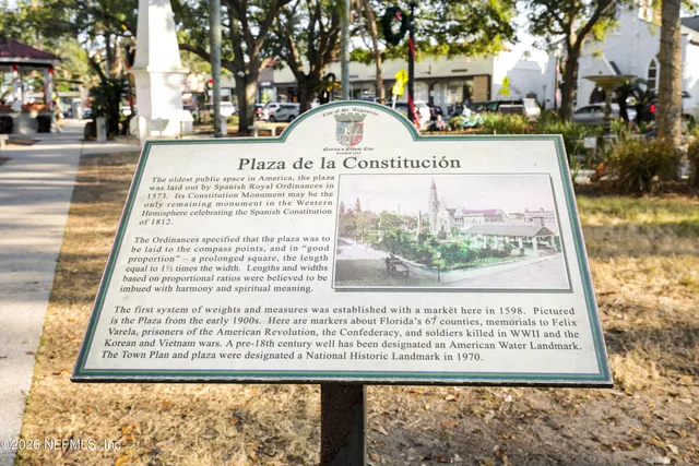 a view of a chair and table in front of house