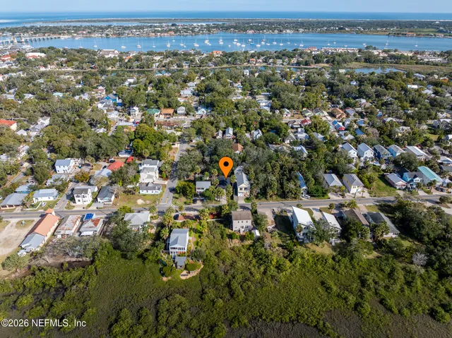 an aerial view of residential houses with outdoor space