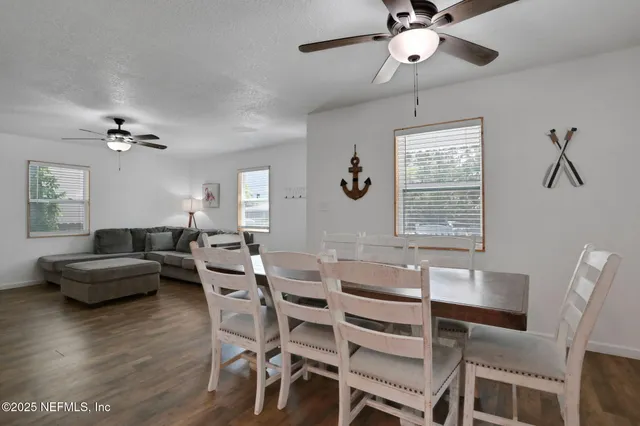 a kitchen with stainless steel appliances kitchen island granite countertop a refrigerator and a stove top oven