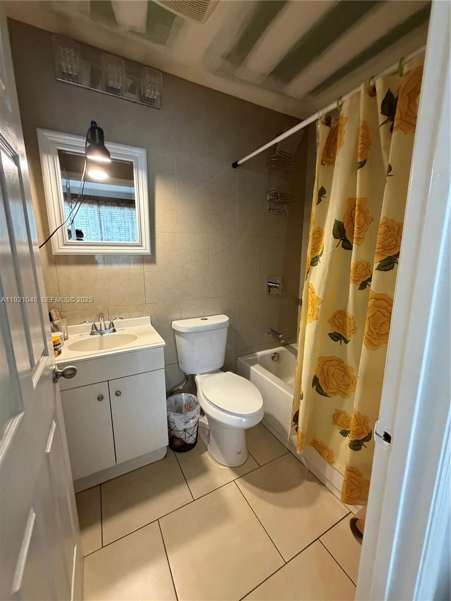 990 Southwest 9th Street Miami, FL 33130 - Photo 4 of 15 a white toilet sitting next to a bathroom sink and a shower