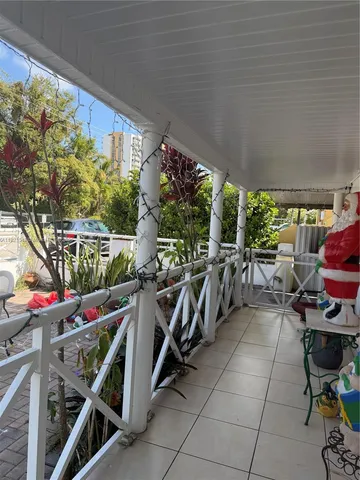 a view of a chairs and table in a patio