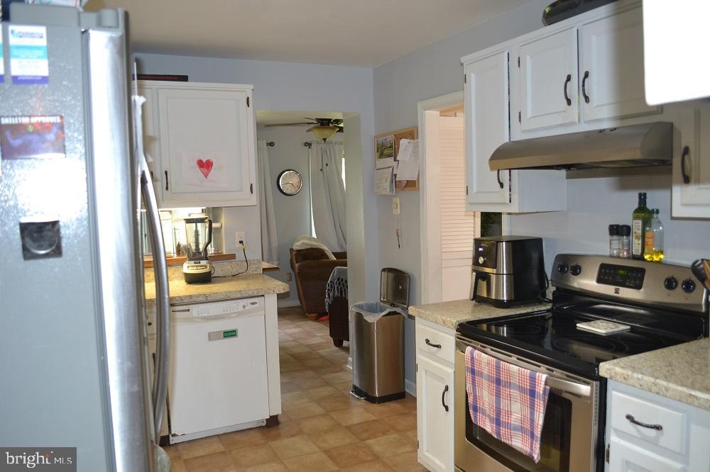1837 Watson Road Abington, PA 19001 - Photo 13 of 33 a kitchen with granite countertop a sink stove and refrigerator