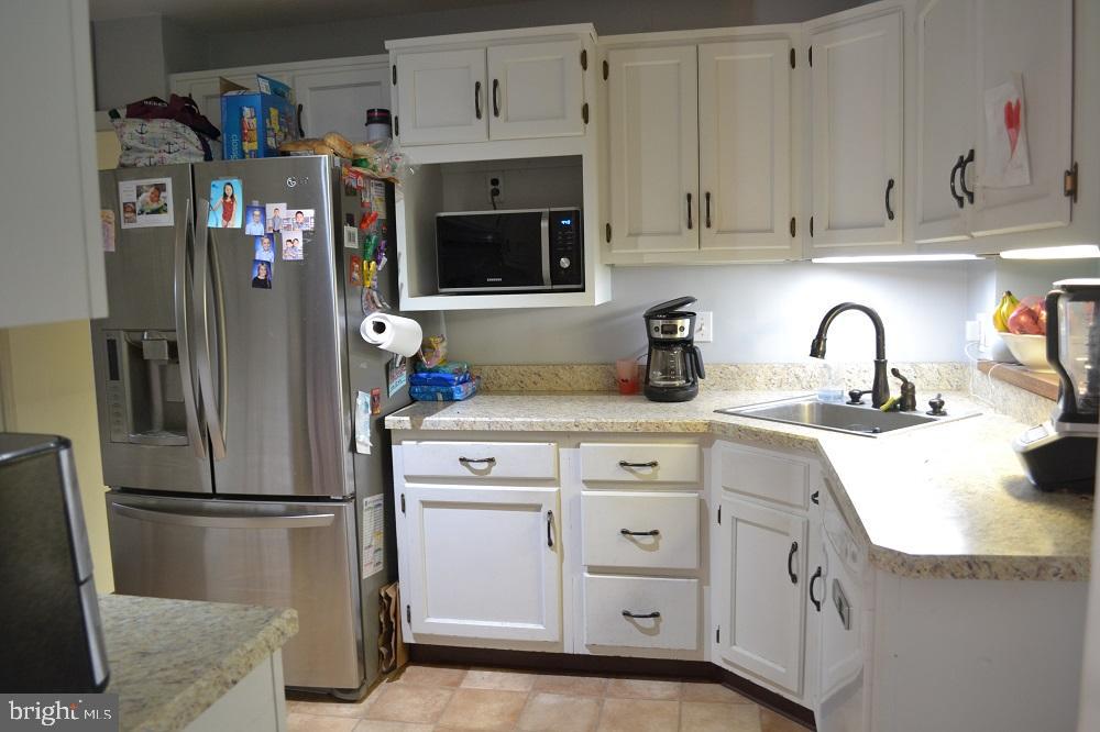 1837 Watson Road Abington, PA 19001 - Photo 14 of 33 a kitchen with stainless steel appliances granite countertop a refrigerator and a sink