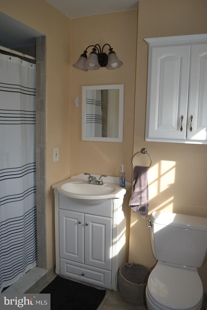 1837 Watson Road Abington, PA 19001 - Photo 23 of 33 a bathroom with a toilet a sink and a window