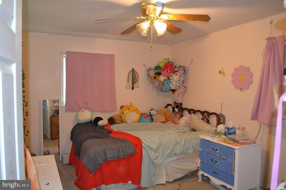 1837 Watson Road Abington, PA 19001 - Photo 25 of 33 a bedroom with a bed and a chandelier