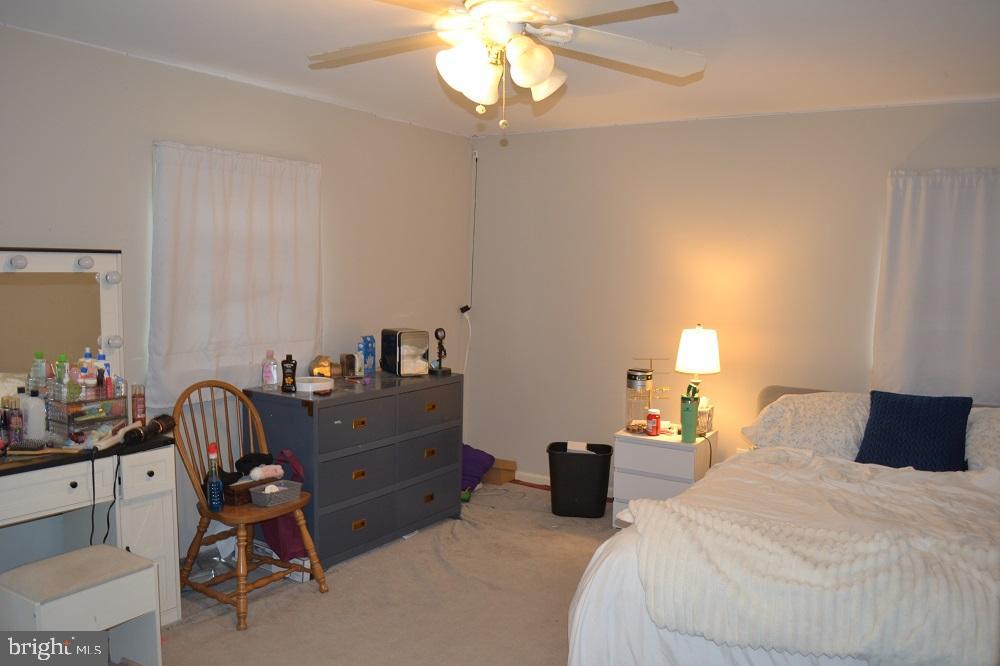 1837 Watson Road Abington, PA 19001 - Photo 28 of 33 a bedroom with a bed and a chandelier