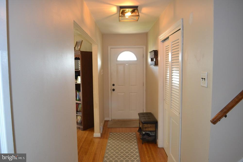 1837 Watson Road Abington, PA 19001 - Photo 4 of 33 a view of a hallway with wooden floor and a bathroom