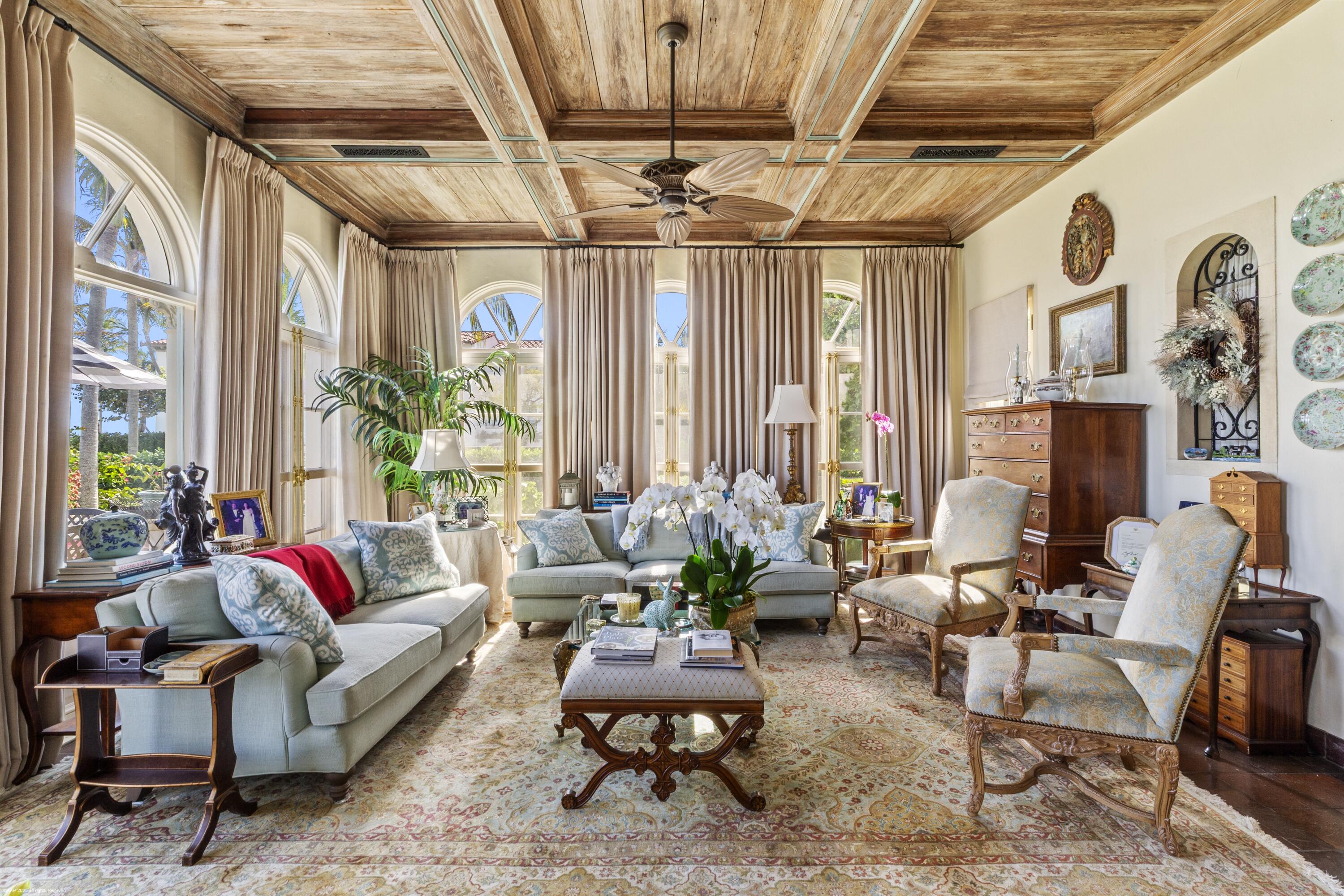 245 Valencia Road West Palm Beach, FL 33401 - Photo 13 of 39 a living room with furniture and a chandelier