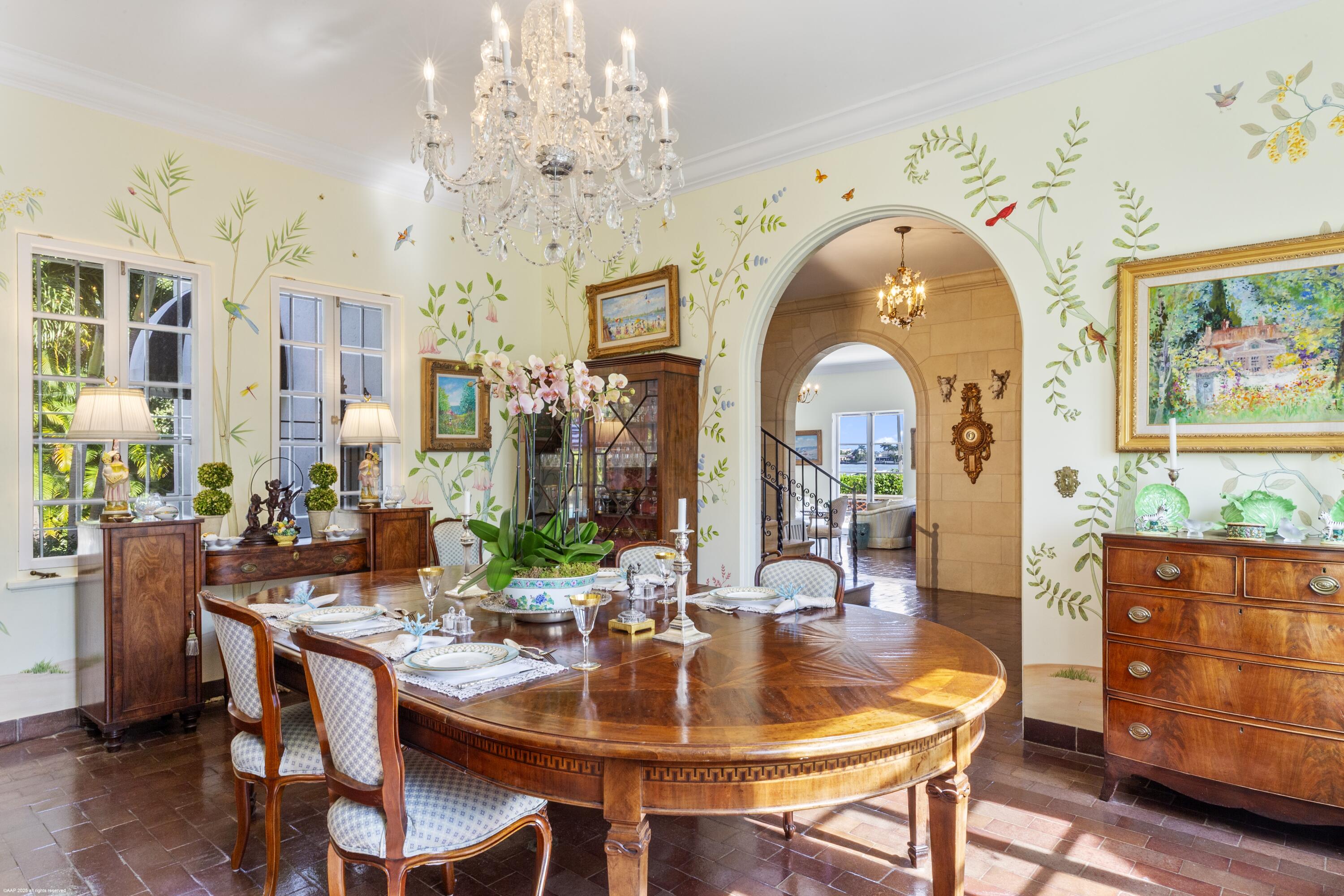 245 Valencia Road West Palm Beach, FL 33401 - Photo 17 of 39 a view of a dining room with furniture and chandelier