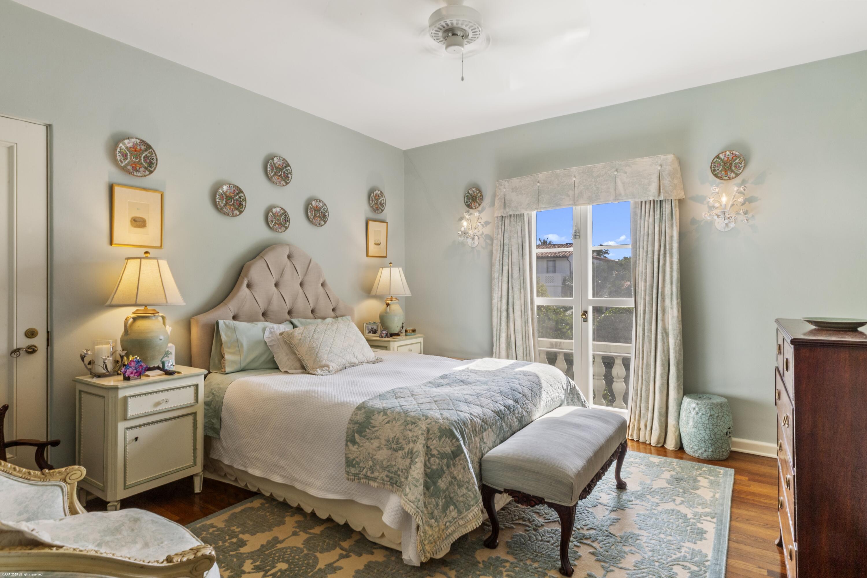 245 Valencia Road West Palm Beach, FL 33401 - Photo 22 of 39 a bedroom with a bed and a chair