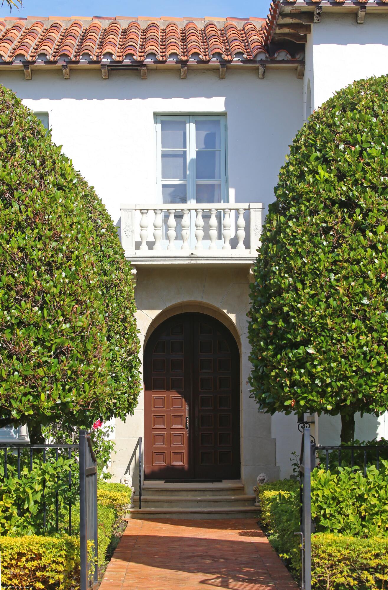 245 Valencia Road West Palm Beach, FL 33401 - Photo 6 of 39 a front view of a house with lake view