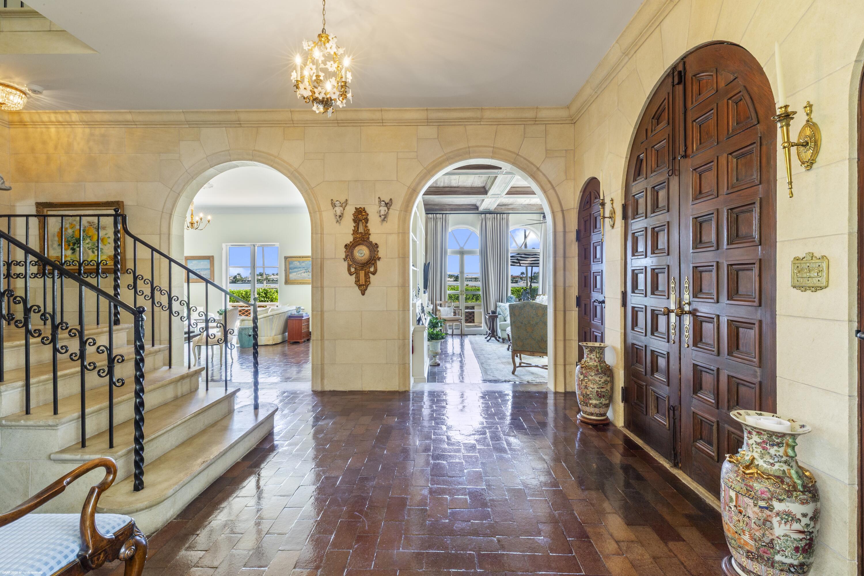 245 Valencia Road West Palm Beach, FL 33401 - Photo 8 of 39 a view of hall way with furniture and staircase