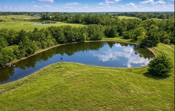 a view of a lake with a yard