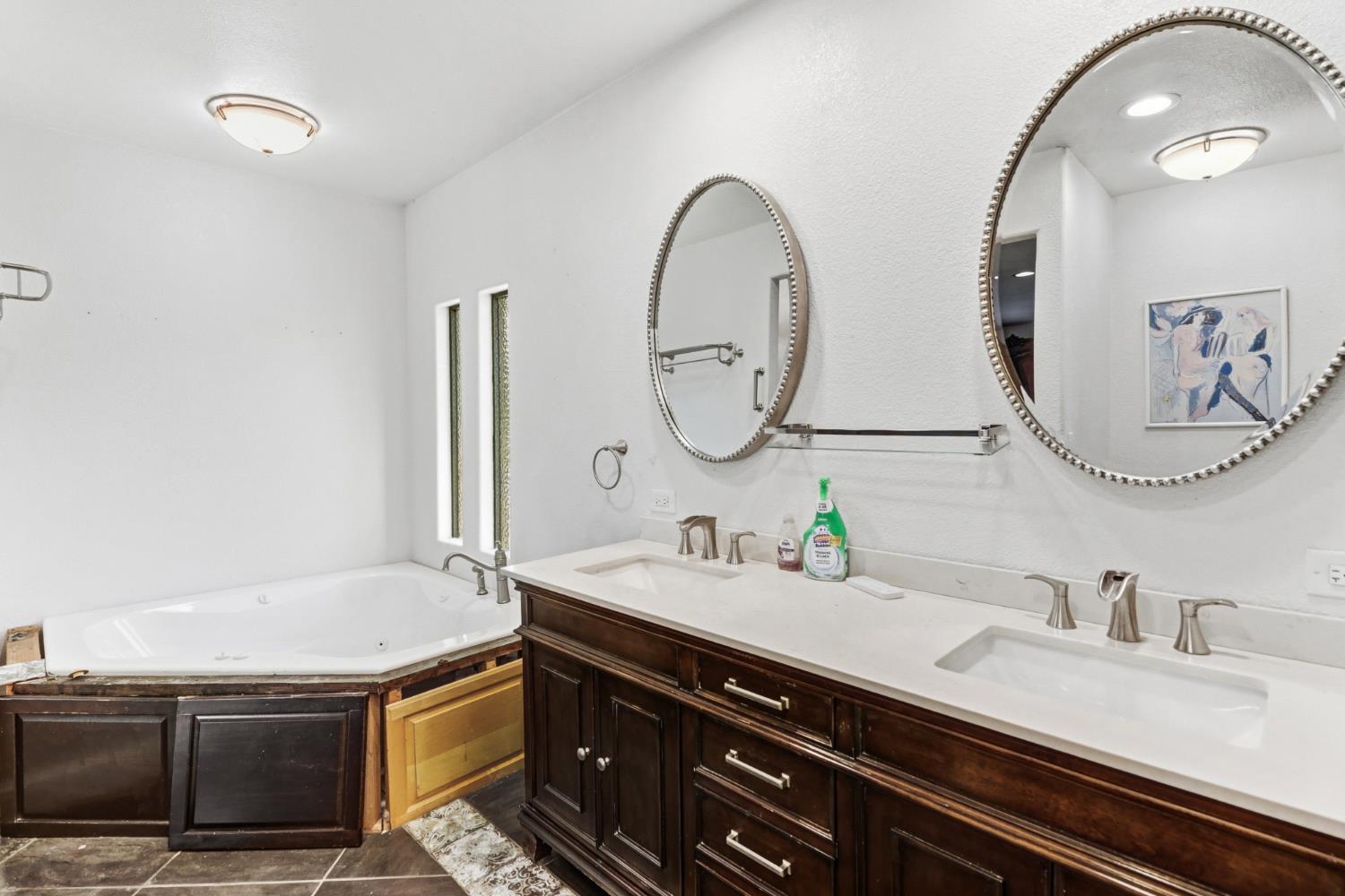 4330 Cavitt Stallman Road Granite Bay, CA 95746 - Photo 29 of 85 a bathroom with a sink and a mirror