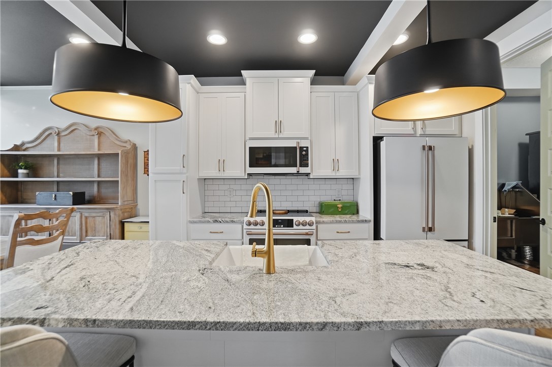 605 Cape Cod Court Beavercreek, OH 45430 - Photo 9 of 54 This spacious kitchen features ample counter space and modern appliances, perfect for culinary endeavors.