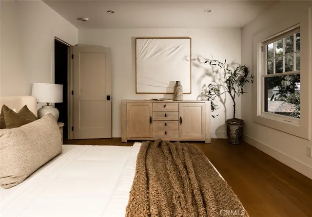 a bedroom with a bed and window