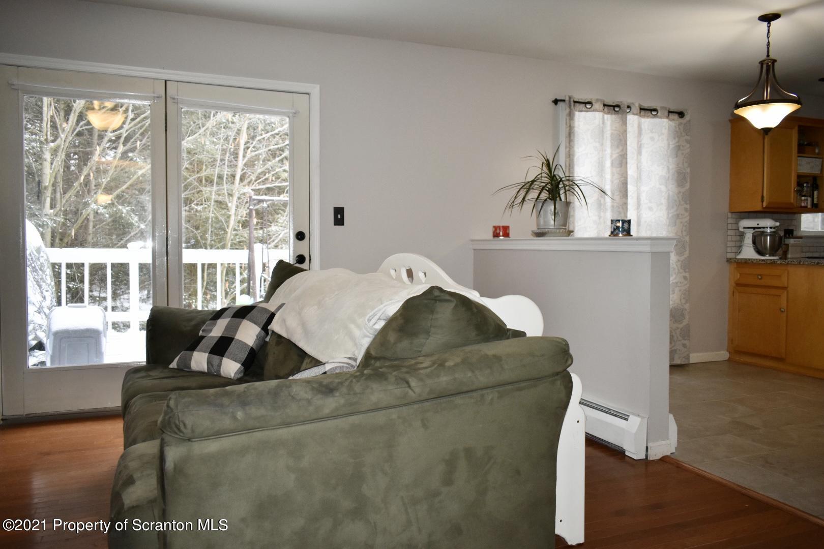 378 Lake Road Tobyhanna, PA 18466 - Photo 11 of 46 a living room with furniture and a large window