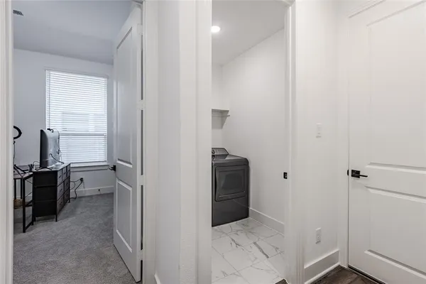a view of storage and utility room with washer and dryer