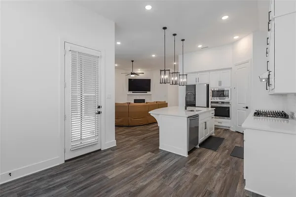 a spacious bedroom with a bed and a window