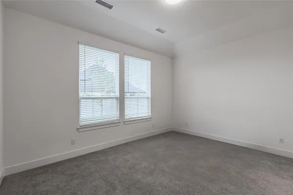 a room with a bed and a night stand