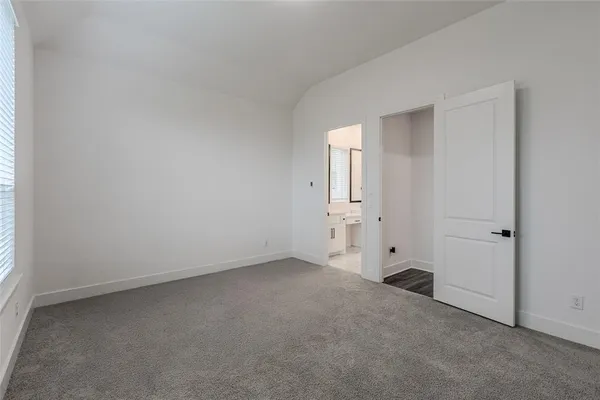 a bathroom with a double vanity sink mirror and shower
