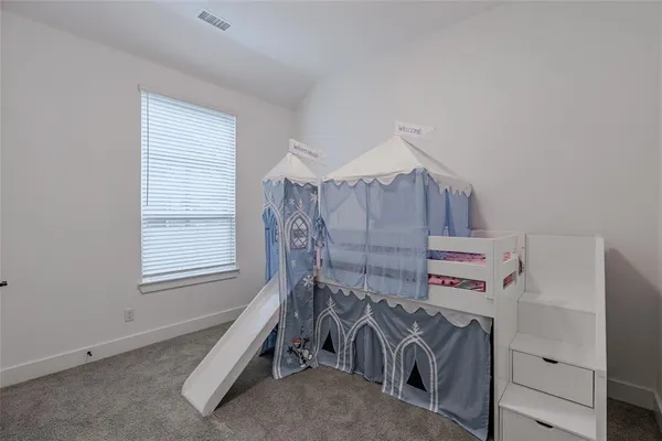 a bathroom with a sink a toilet a mirror and shower curtain