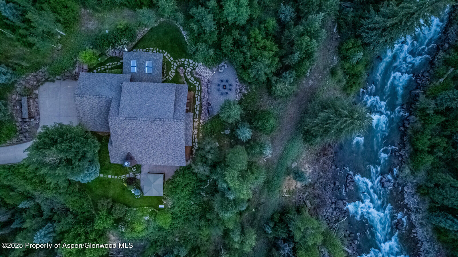 606 Dorais Way Redstone, CO 81623 - Photo 103 of 103 an aerial view of a house with yard and trees all around