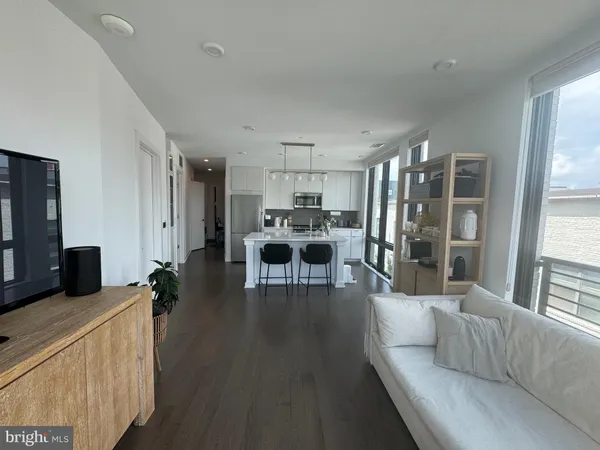 a living room with furniture and a table