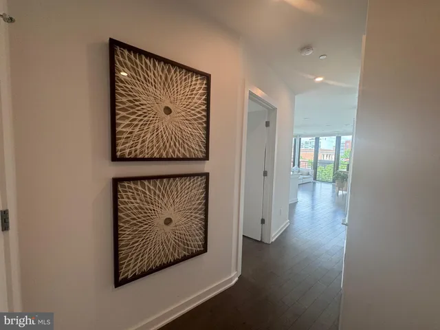 an entryway with wooden floor