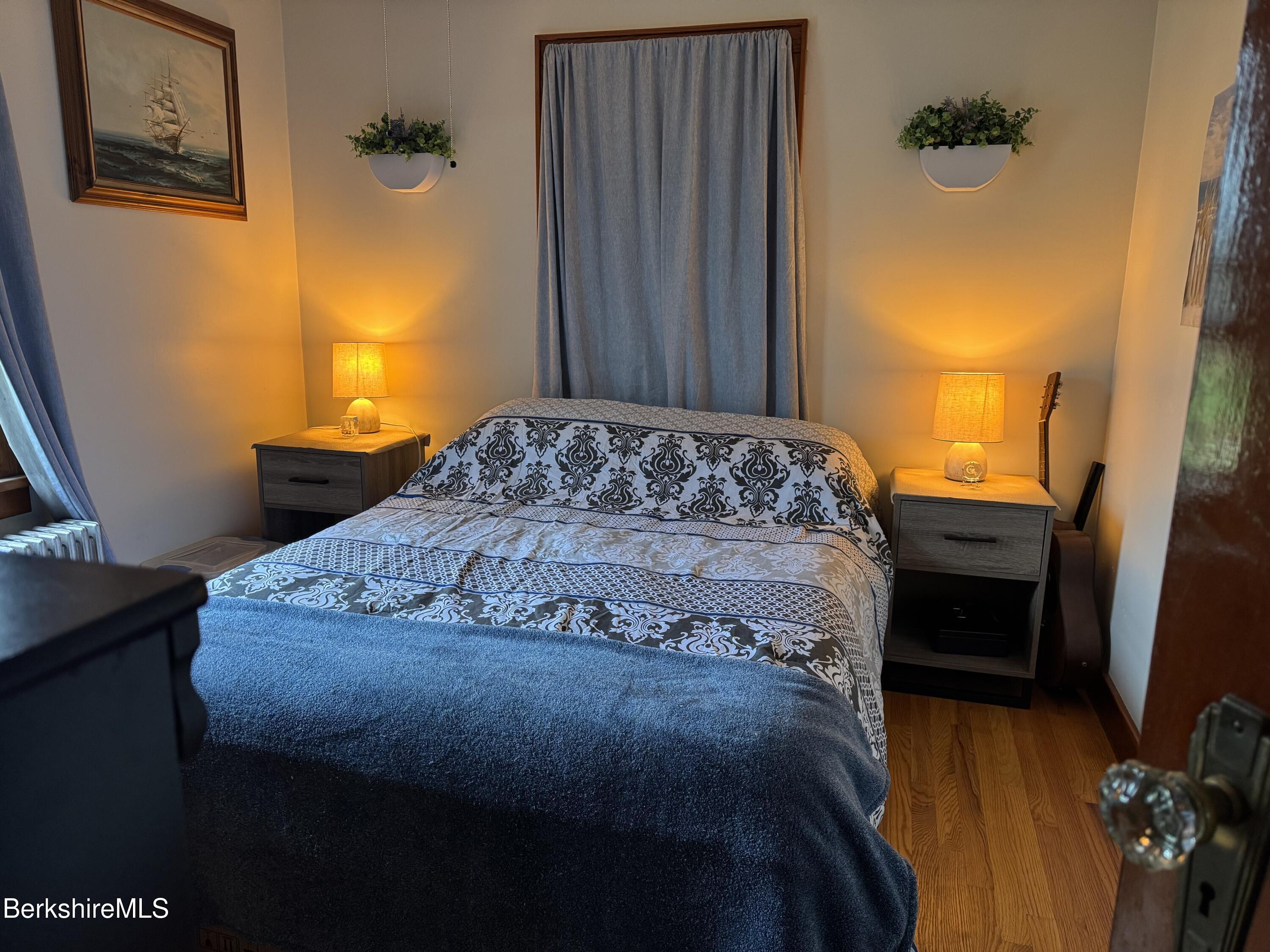 13 Water Street Adams, MA 01220 - Photo 12 of 15 a bedroom with a bed dresser and a window