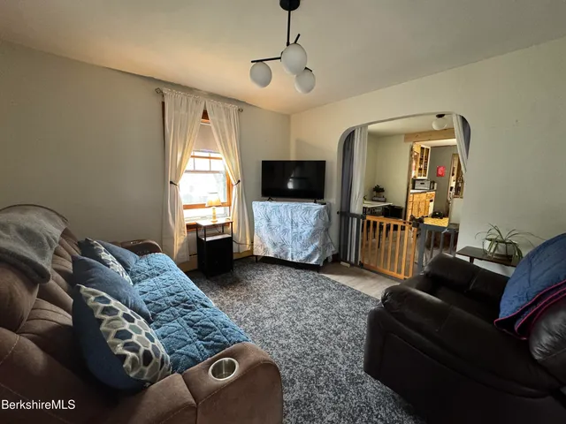 a bedroom with furniture and a window