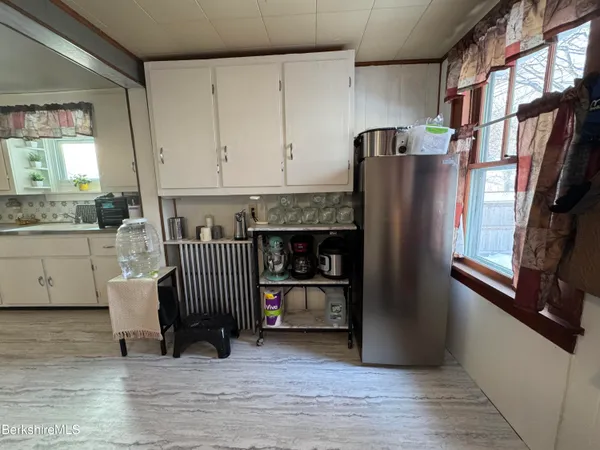 a kitchen with stainless steel appliances granite countertop a refrigerator and a stove