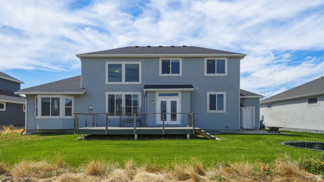 111 East Silver Oak Road Vineyard, UT 84059 - Photo 39 of 50 Rear exterior featuring a spacious wooden deck with railings, dual glass-paneled doors, and a bay window