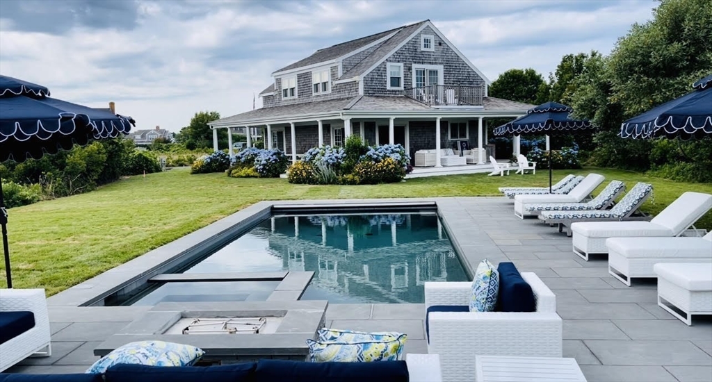 7 Packet Drive Nantucket, MA 02554 - Photo 23 of 38 a view of a house with pool and chairs