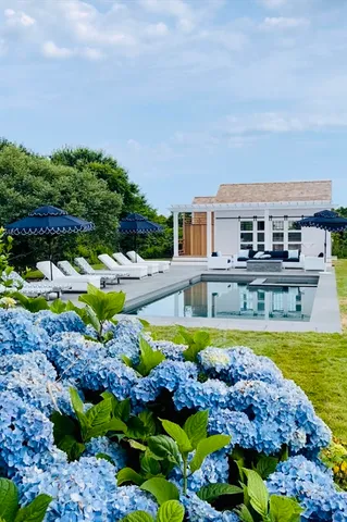 a view of a swimming pool and a yard