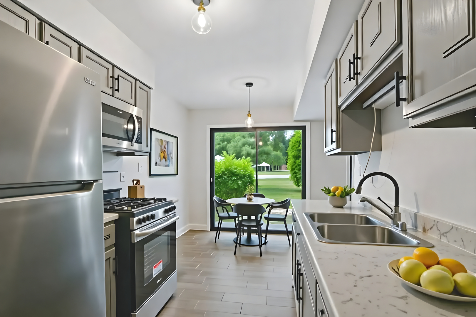 452 Harrison Court Vernon Hills, IL 60061 - Photo 5 of 11 a kitchen with stainless steel appliances granite countertop a sink a stove and a refrigerator