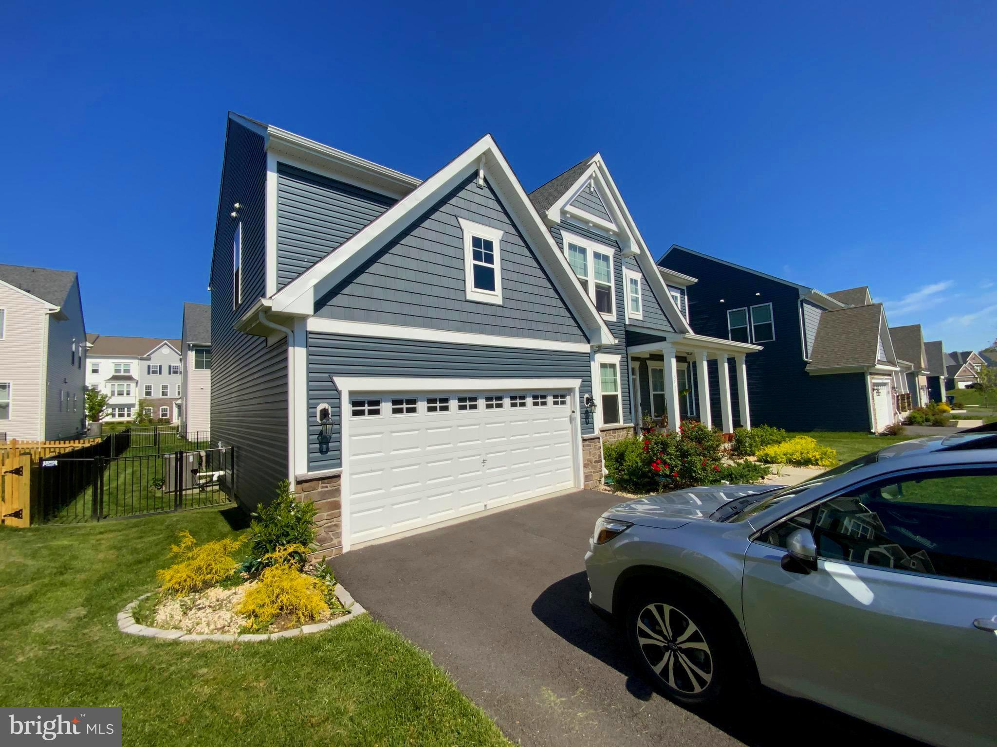 5763 Hawk Ridge Road Frederick, MD 21704 - Photo 37 of 73 a front view of a house with a yard