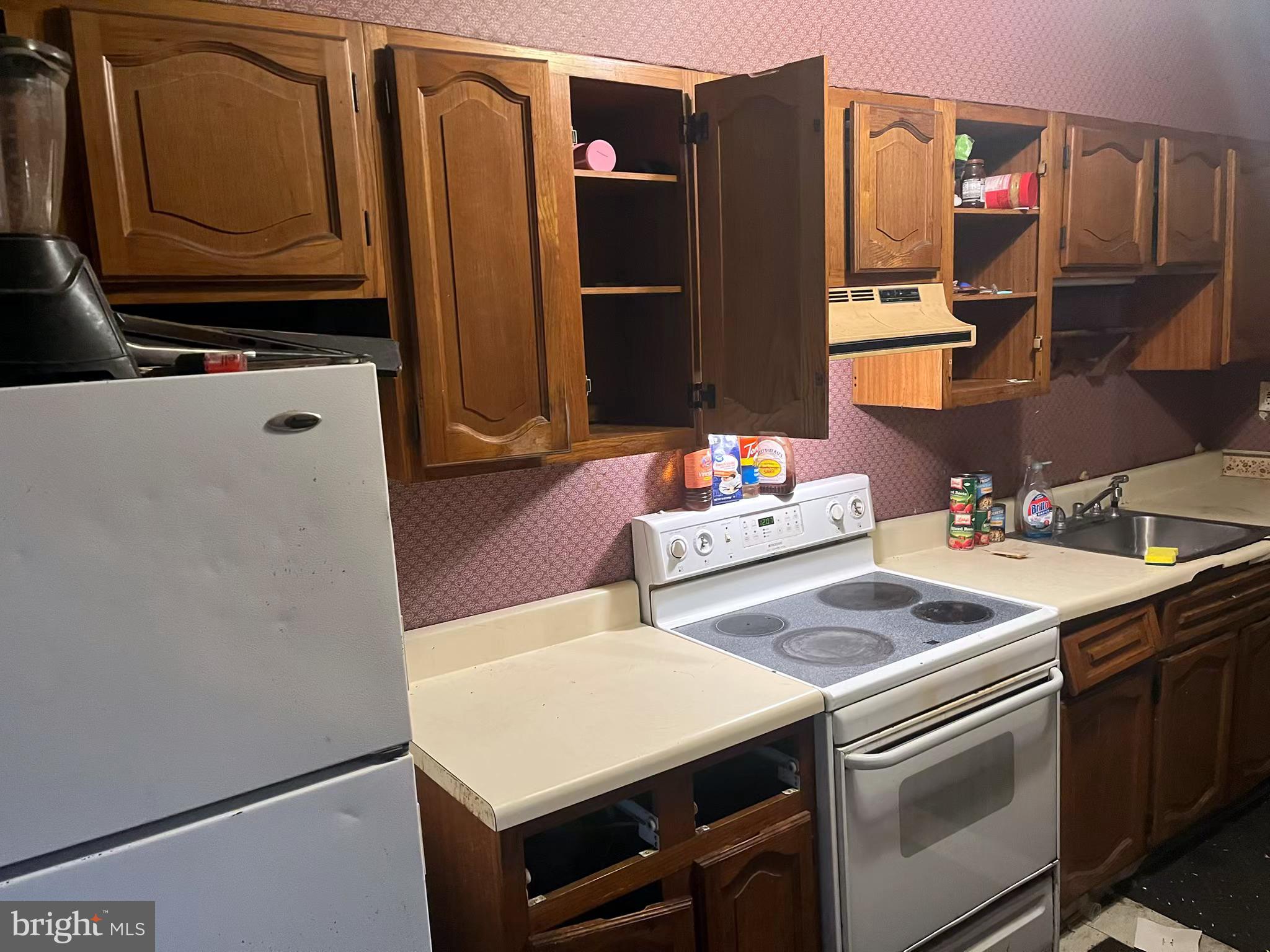 261 Friedensburg Road Reading, PA 19606 - Photo 4 of 5 a kitchen with stainless steel appliances a stove a microwave and a refrigerator