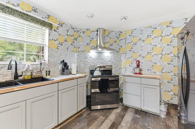 a kitchen with sink cabinets and window