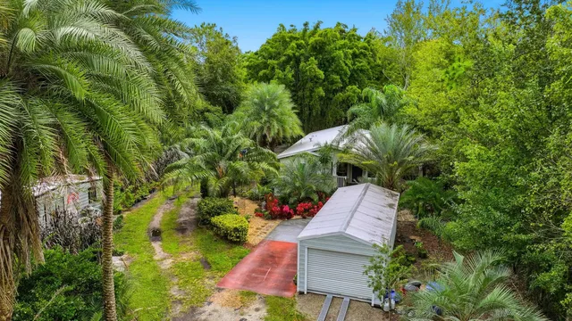 an aerial view of house with yard