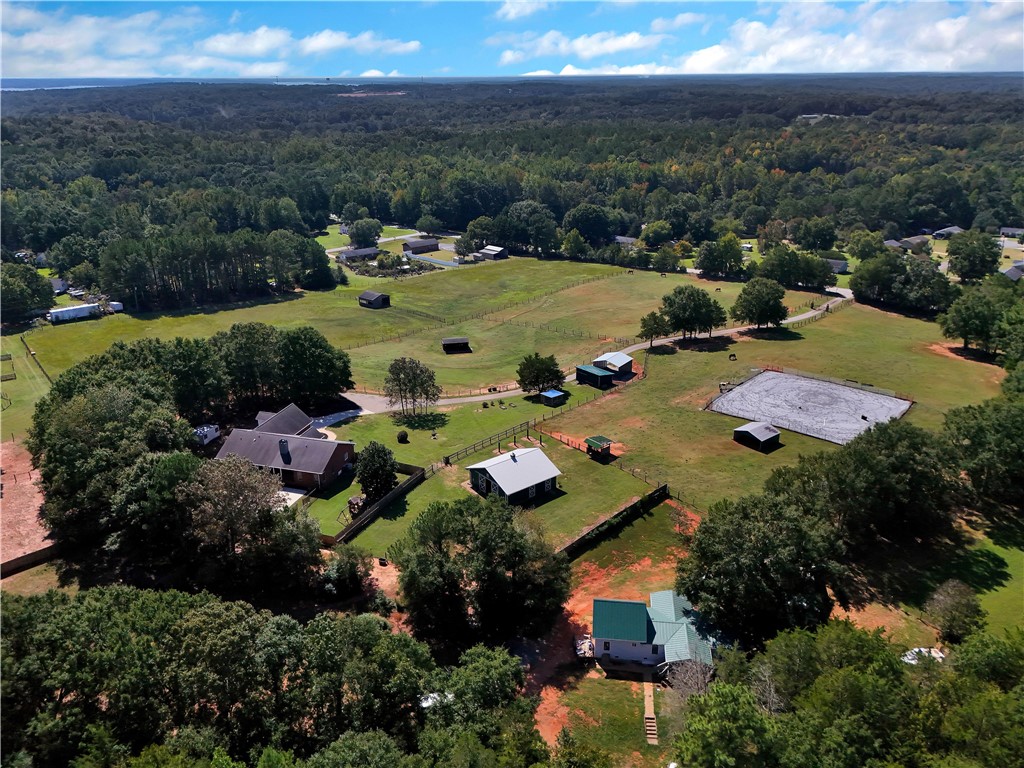 3620 Centerville Road Anderson, SC 29625 - Photo 48 of 49 An expansive rural landscape features fenced pastures, multiple outbuildings, and a riding arena.